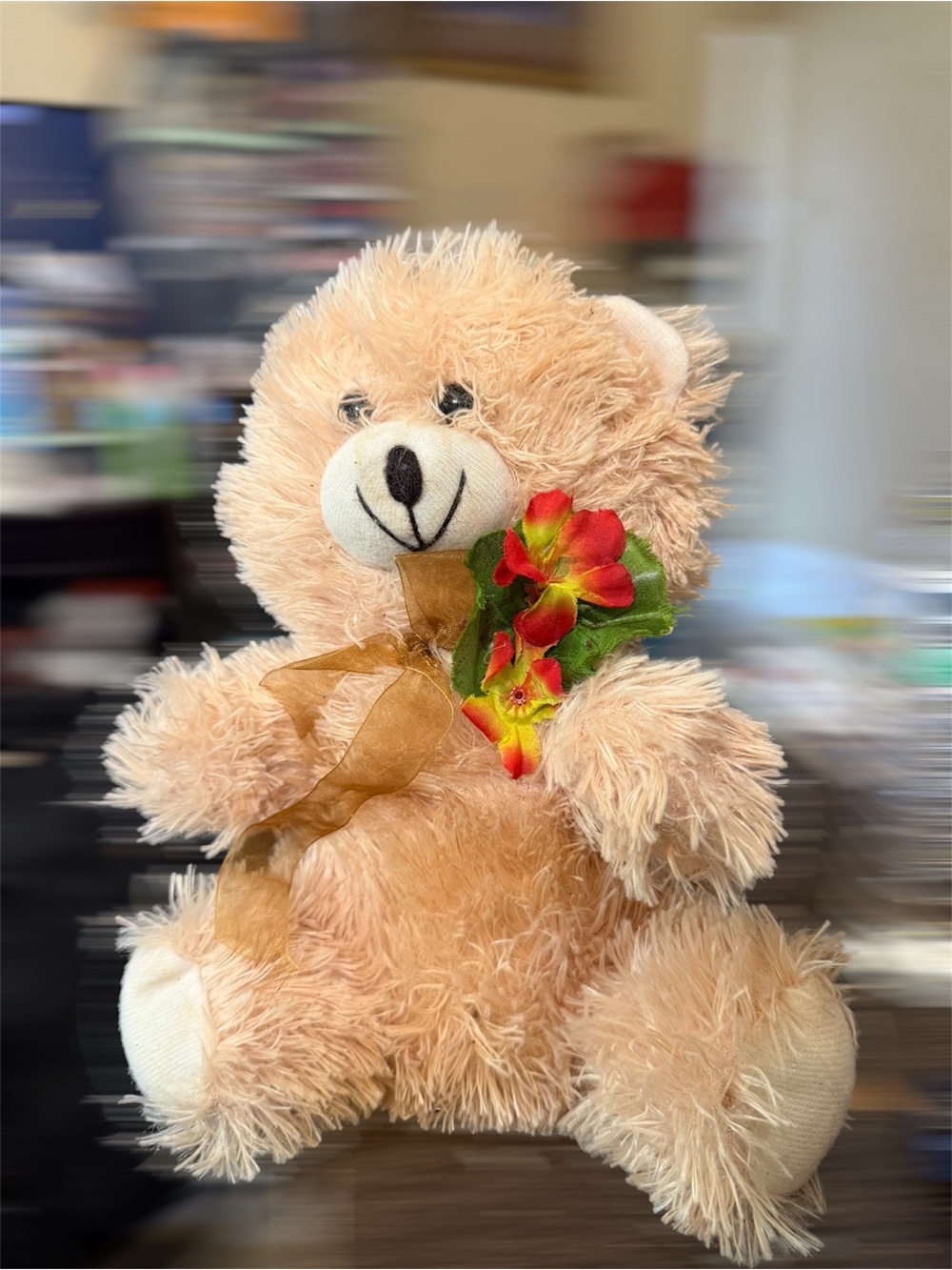 Plush Beige Teddy Bear with Floral Accent and Gold Bow